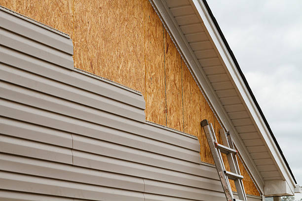 Professional Storm Damage Siding Repair technician working in Gloucester, MA